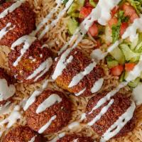 Falafel Over Rice · Veggie falafel ( ground garbanzo chick peas) and other spices, served over rice with freshly...