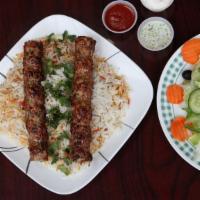 Chicken Kofta Kabab Plate · Two skewers of chicken kofta with spicy or non spicy rice with side of salad and white sauce