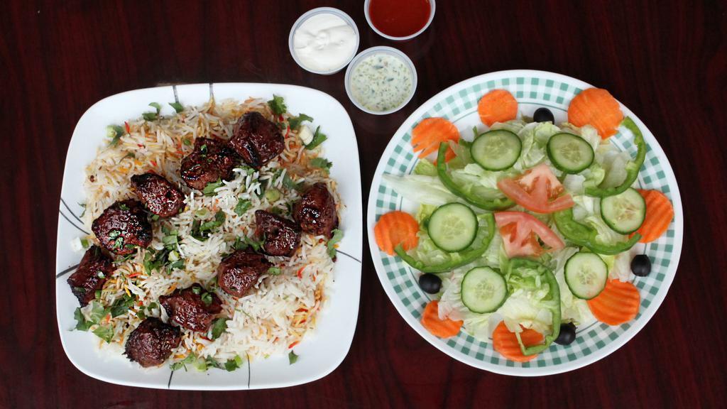 Beef Tikka Kabab · 2.beef  tikka skewer with rice, side of salad and white sauce