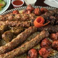 53….Grill Kabab Special (12 Skewers) · Serves 5-6 people with rice, 3 chicken kofta, 3 chicken tikka,2 lamb tikka, 2 beef kofta,2 b...
