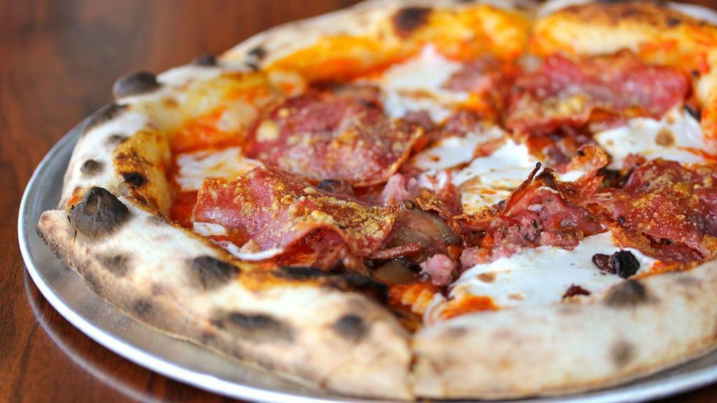 Large Carnivore Pizza

 · A4 Mozzarella, tomato, sopressata, sausage, and bacon.