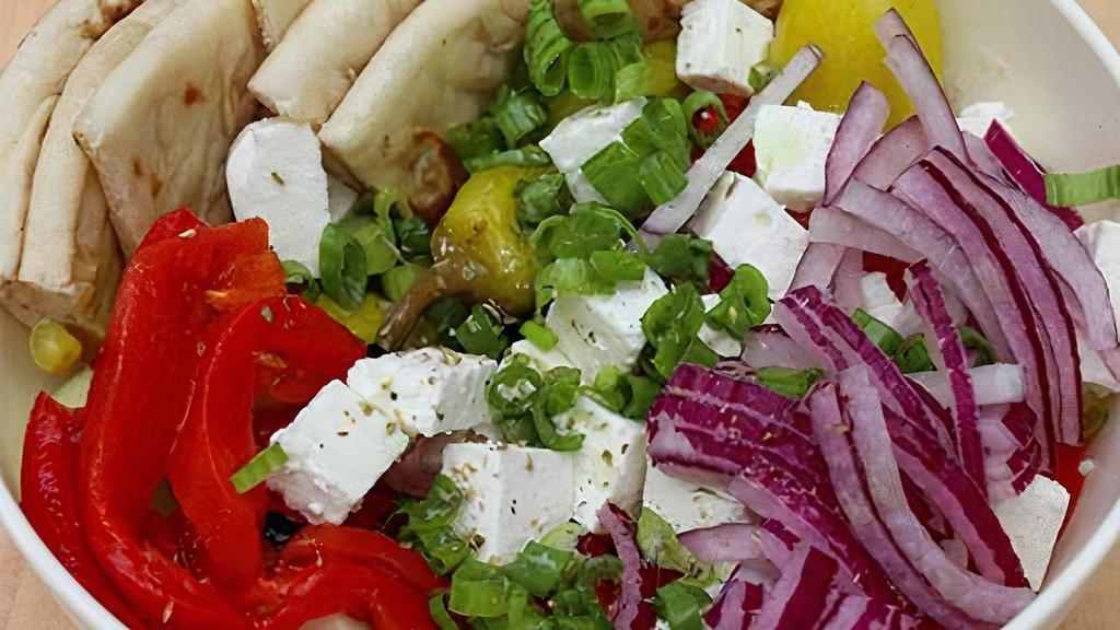 Village Salad · Tomato base topped with cucumbers,red onions,roasted red peppers,kalamata olives,scallions,feta cheese,and pepperoncini peppers. Served with a sliced pita and the yeeroh vinaigrette on the side.