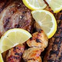 Mix Grill · Grilled pork souvlaki,chicken souvlaki,loukaniko,pantseta,and kebab with pita slices and Fre...