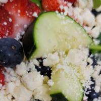 Berry Greek Salad · Spinach, Mix Berries, Cucumber, Chickpeas, Feta Cheese w/ Balsamic Vinaigrette
