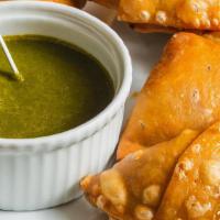 Samosa · Indians’ most popular snack, pastry with stuffing of lightly spiced potatoes and peas.