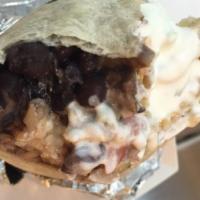 Breakfast Ranchero Burrito · Our very own, and famous breakfast rachero burrito. Flour tortilla filled with scrambled egg...