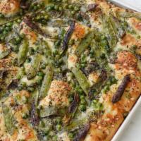 Ricotta & Pea Flatbread Slice · Housemade flatbread dough baked with fontina, roasted garlic, snow, snap and sweet peas topp...