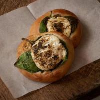 Spinach & Labneh Pita · Pita dough baked with fresh spinach leaves and labneh. Topped with za'atar spice.. Contains:...