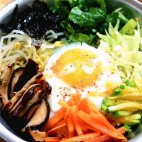 Veggie Bibimbap · Rice topped w/ assorted vegetables and sesame oil in a bowl