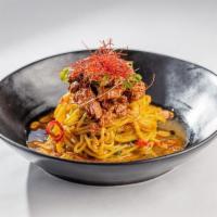 Korean Beef Bulgogi Over Egg Noodles · Chinese Broccoli, Chilies, Fried Garlic