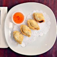 New! Chicken Curry Puff · Thai puff with chicken, potatoes, carrot, corn and curry powder.