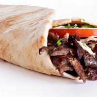 Beef Shawarma · Beef, tomatoes, turnip pickles, cucumber pickles with tahini sauce and parsley, onions, and ...