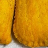Jamaican Beef Patties · Spicey minced beef blended with herbs and filled in a flaky pastry crust then baked until go...