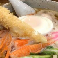 Nabe Yaki Udon · Noodle soup with shrimp tempura, chicken, egg and vegetables.