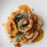 Shrimp And Grits · fresh shrimp, marsh hen mills speckled grits, tomato-shellsh gravy, andouille sausage, carro...