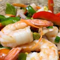Shrimp Salad · Steamed shrimps tossed with red onion, pepper, cucumber and cilantro in spicy lime dressing.