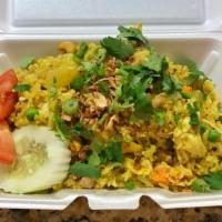 Pineapple Fried Rice · Stir fried jasmine rice with curry powder, pineapple, egg, cashew nuts, and scallion.