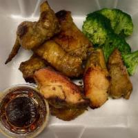 Kai Yang (Grilled Chicken) · Grilled marinated Thai style half chicken 
Served with sticky rice and broccoli