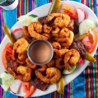 Tres Amores · Deep fried breaded shrimp, calamari and fish.