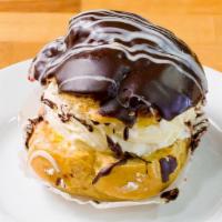 Chocolate Cream Puff · Rich and moist chocolate cake layered with creamy chocolate mousse and topped with fresh whi...