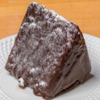 Alpine · Chocolate cake layered with fresh homemade whipped cream and coated in crunchy chocolate fud...