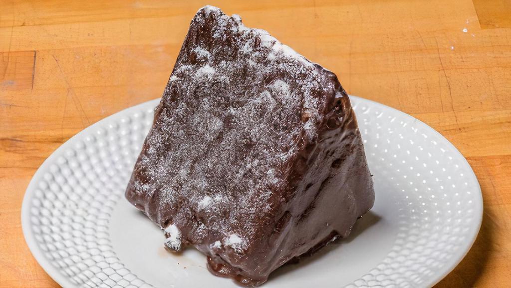 Alpine · Chocolate cake layered with fresh homemade whipped cream and coated in crunchy chocolate fudge.
