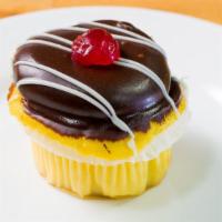 Boston Cream Cupcake · Yellow cake filled with Italian custard topped with chocolate frosting dipped in ganache and...