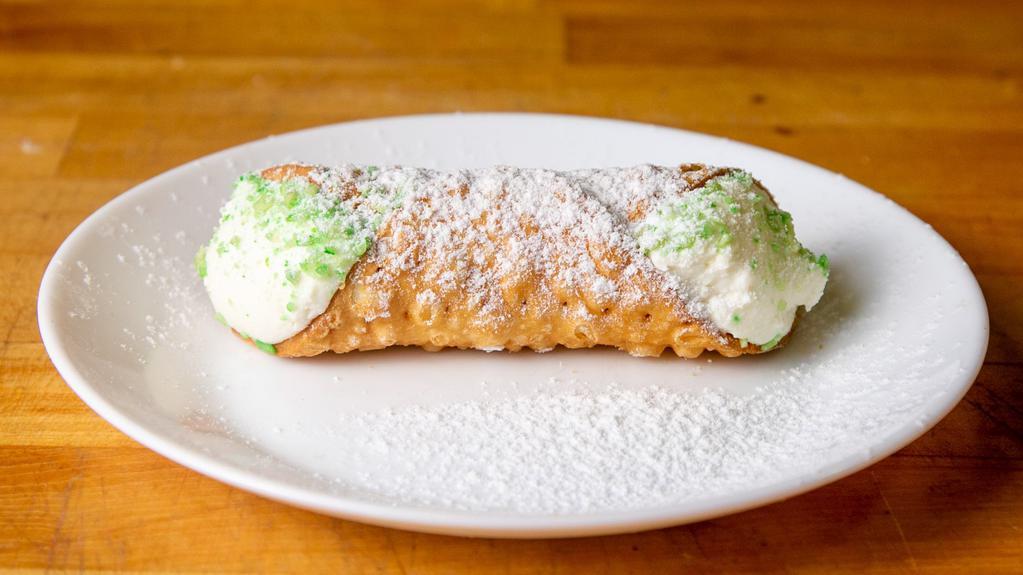 Large Cannoli · Large cannoli shell filled with fresh homemade ricotta, sprinkled with pistachios.