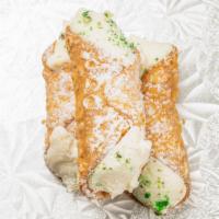 Mini Cannoli · Mini cannoli shell filled with fresh homemade ricotta, sprinkled with pistachios.