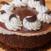 Chocolate Mousse Torte · 6-8 slices. Rich and moist chocolate cake layered with creamy chocolate mousse and topped wi...