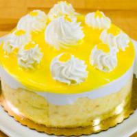 Lemon Mousse Torte · 6-8 slices. Moist gold cake layered with refreshing lemon mousse coated with a lemon glaze a...