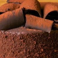 Chocolate Nightmare Torte · 6-8 slices. Moist chocolate fudge cake layered with savory swiss chocolate, coated with choc...