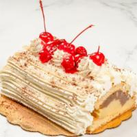 Rum Log · 6 slices. Sponge cake soaked in artificial rum with layers of whipped and vanilla and chocol...
