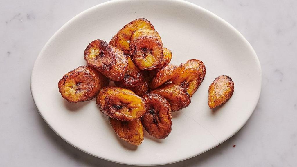 Fried Plantains · Ripe sweet plantains are fried until golden brown with a caramelized texture and sweet flavor.