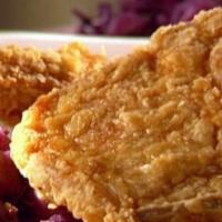 Fried Pork Chops · Tender and juicy fried pork chops. Served with two side dishes and choice of bread on the si...