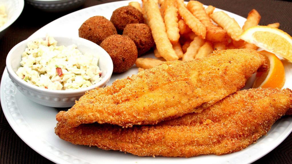 Fried Catfish · Crispy fried catfish fillet served with two side dishes and choice of bread on the side. We fry in premium canola oil.