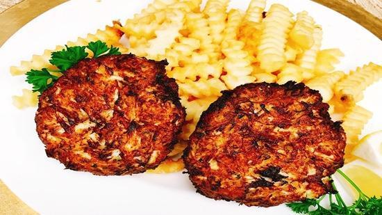 Crab Cakes · Jumbo lump crabmeat. The best Maryland crab cake. Made with real jumbo lump crabmeat. Served with two side dishes and choice of bread on the side. We fry in premium canola oil.