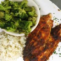 Grilled Blackened Catfish · Catfish fillet with olive oil, coated with a Cajun rub, and grilled to perfection, served wi...
