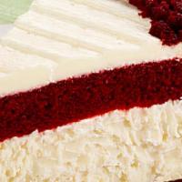 Red Velvet Cheesecake · A layer of red velvet cake with a layer of cheesecake, topped with cream cheese frosting.