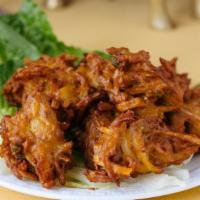 Vegetable Pakora · Vegetable assortment dipped spiced butter deep-fried. Served with sauce.