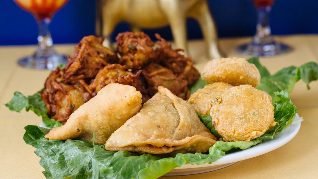 Vegetable Platter. · Combination of assorted (samosa mixed pakora). Served with sauce.