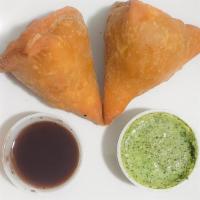 Meat Samosa (Lamb) · Crisp deep fry peas stuffed with spiced minced meat. Served with sauce.