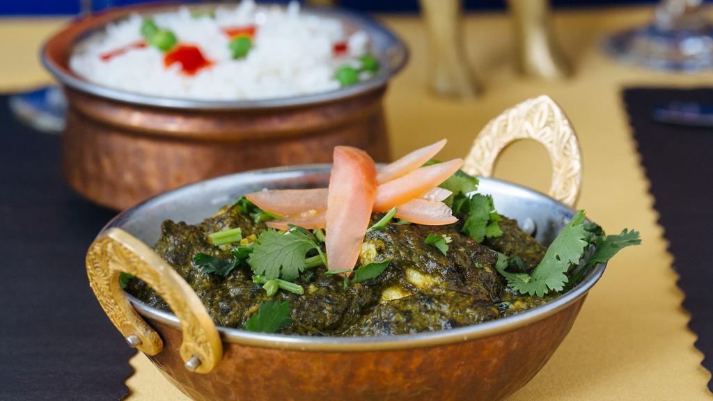 Palak Paneer · Homemade cottage cheese cooked with fresh spinach and spices.