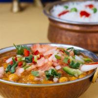 Channa Masala · Chickpeas cooked with fresh tomatoes and spices.