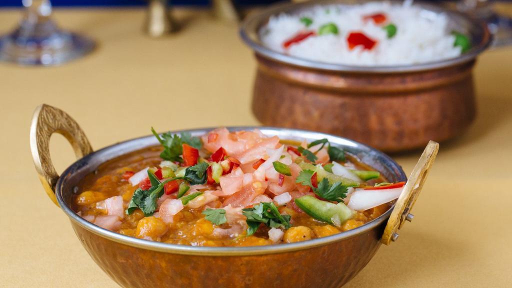 Channa Masala · Chickpeas cooked with fresh tomatoes and spices.