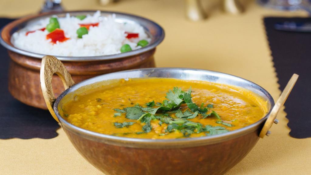 Dal Tadka · Yellow lentils cooked with herbs and spices.