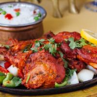 Tandoori Chicken (Half) · Chicken marinated overnight in yogurt freshly ground spices and cooked in tandoor to perfect...