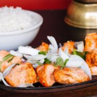 Chicken Tikka · Boneless pieces of chicken marinated aromatic spices and bbq in a clay oven.