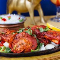 Tandoori Mix Grill · An assortment of chicken, lamb, and seafood.