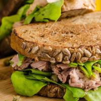 Tuna Salad · With lettuce tomato and onions.